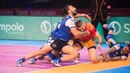 Mohit Chhillar (L) attempts a tackle on Gujarat's Fazel Athrachali